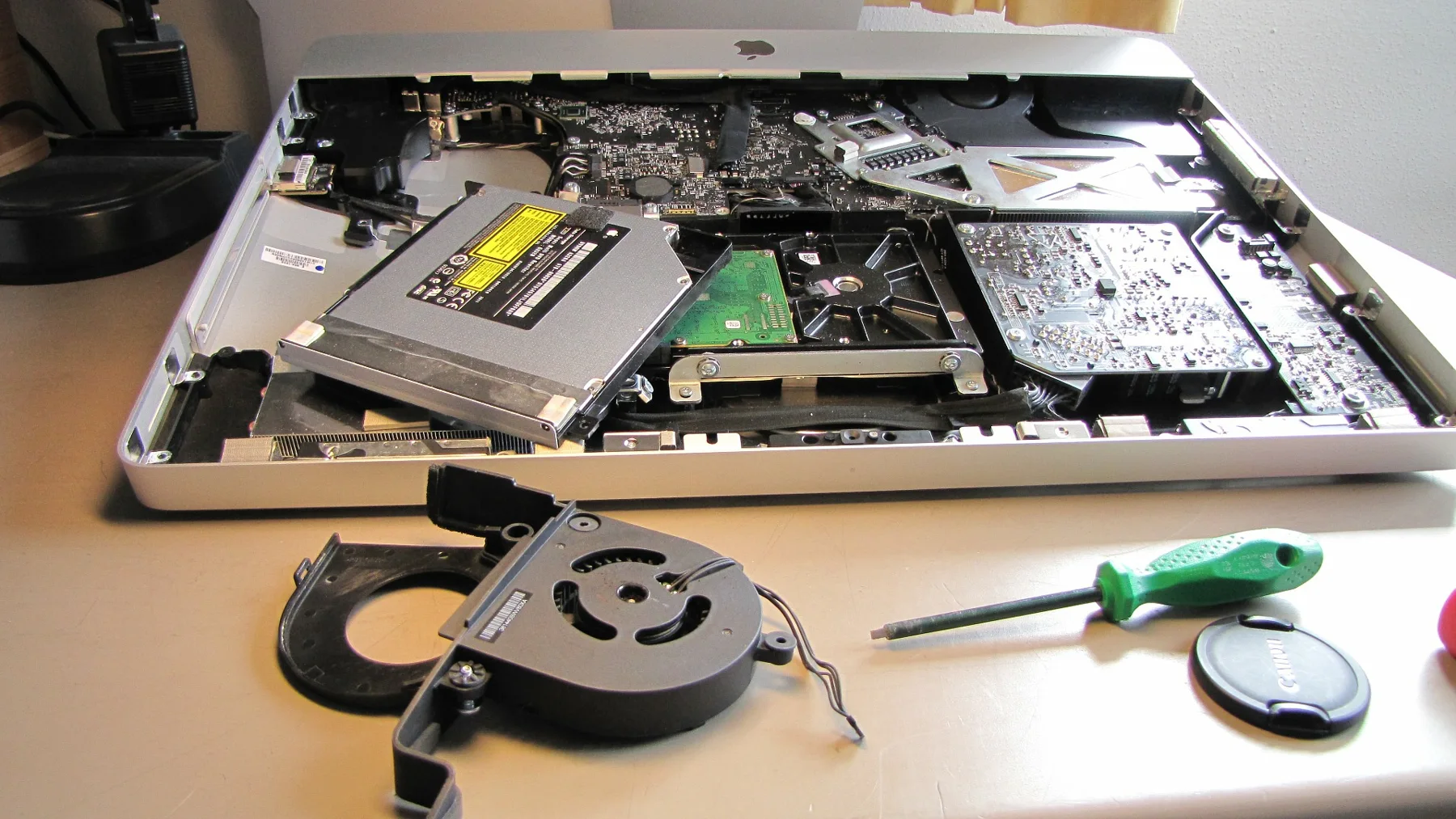 Laptop components and tools on a repair work surface